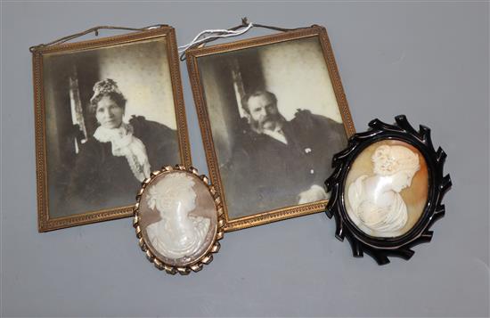 A jet framed cameo brooch, another and two photograph frames